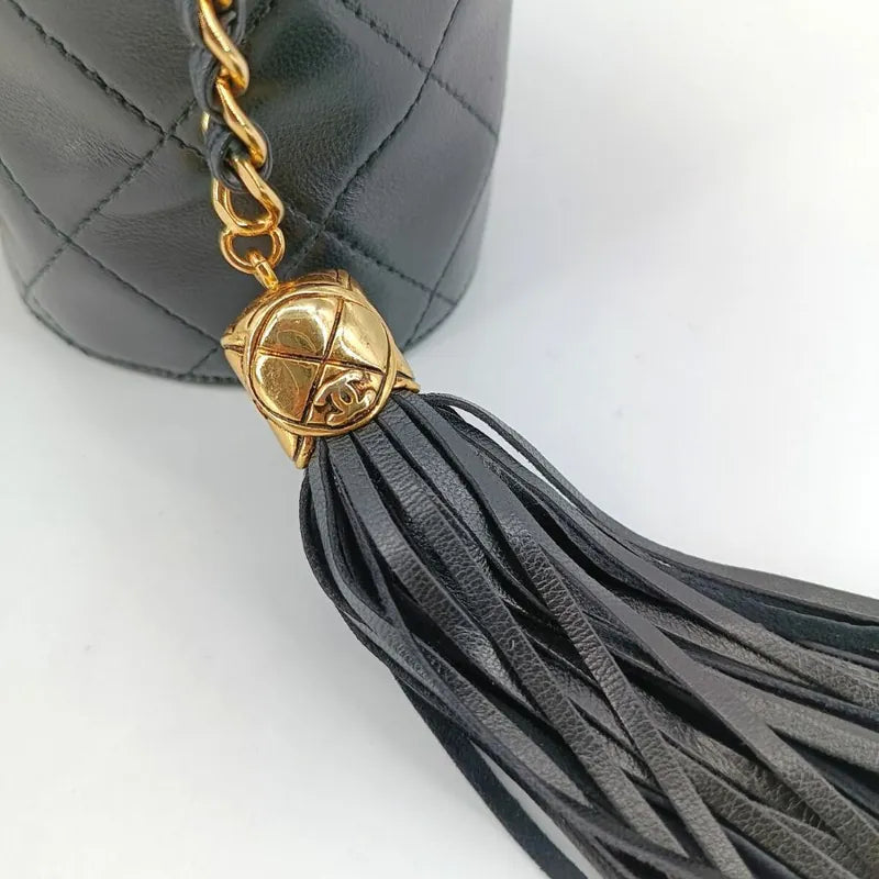 RA253 - CHANEL Vintage Black Lambskin Tassel Bucket Bag