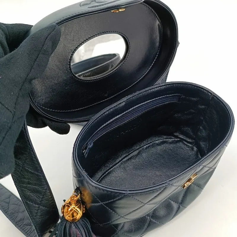 JT581 - CHANEL Vintage Navy Lambskin Tassel Vanity Case Bag