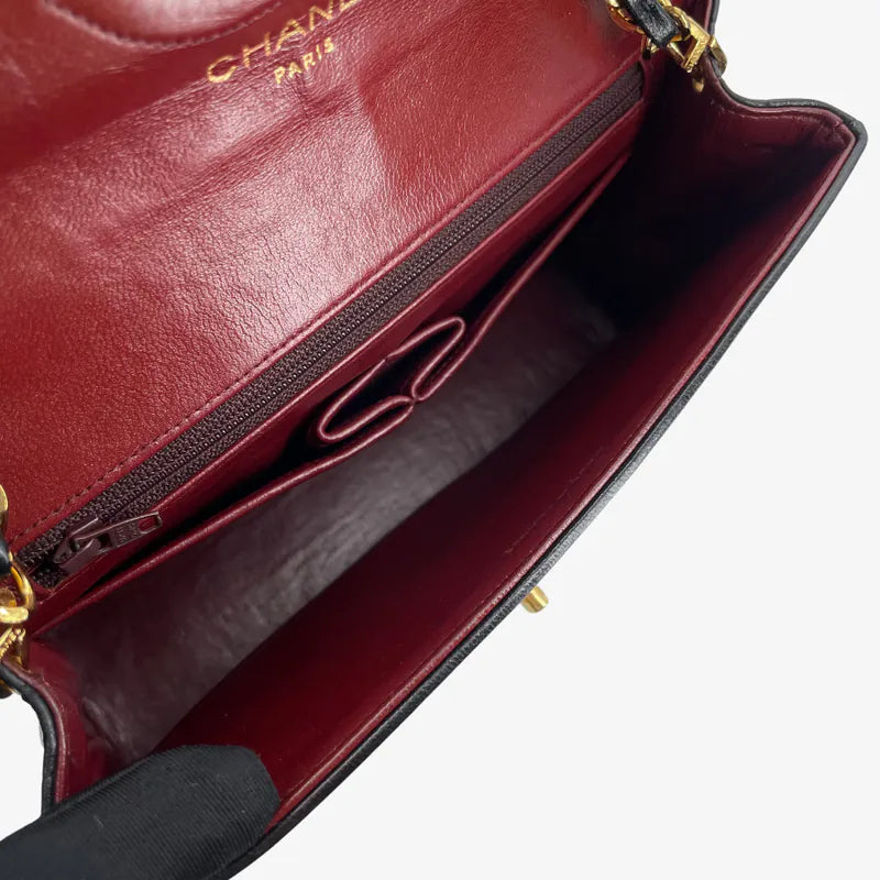 RA652 - CHANEL Vintage Black Lambskin Quilted Flap Bag