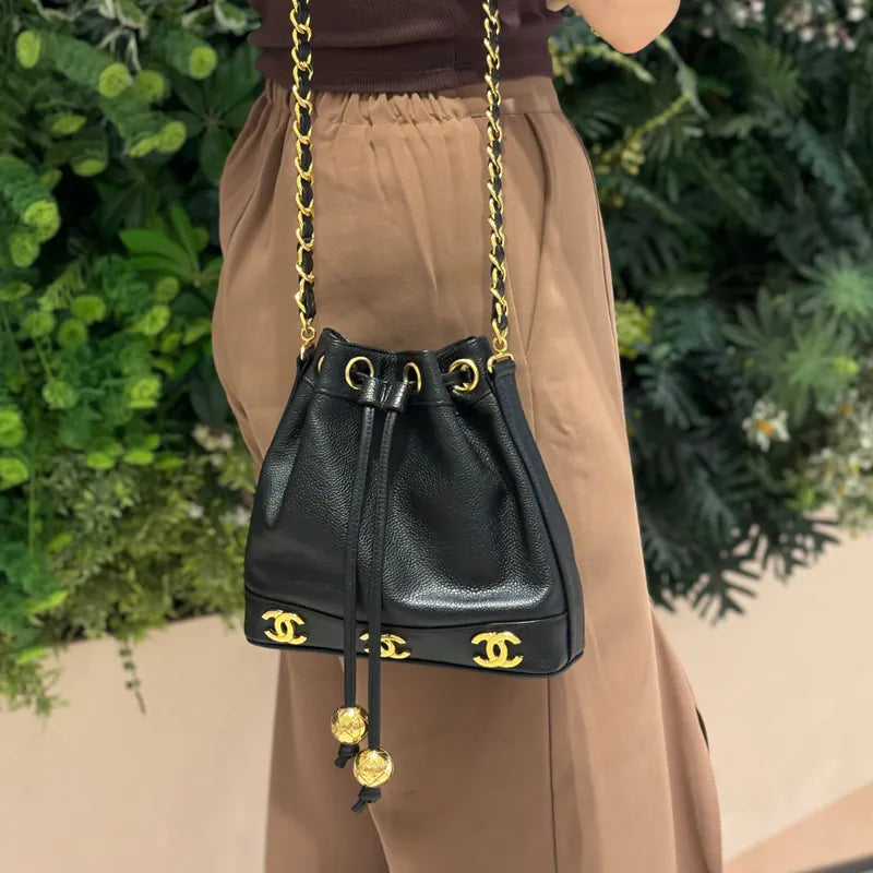 JW675 - CHANEL Vintage Black Caviar Leather Golden Ball Bucket Bag