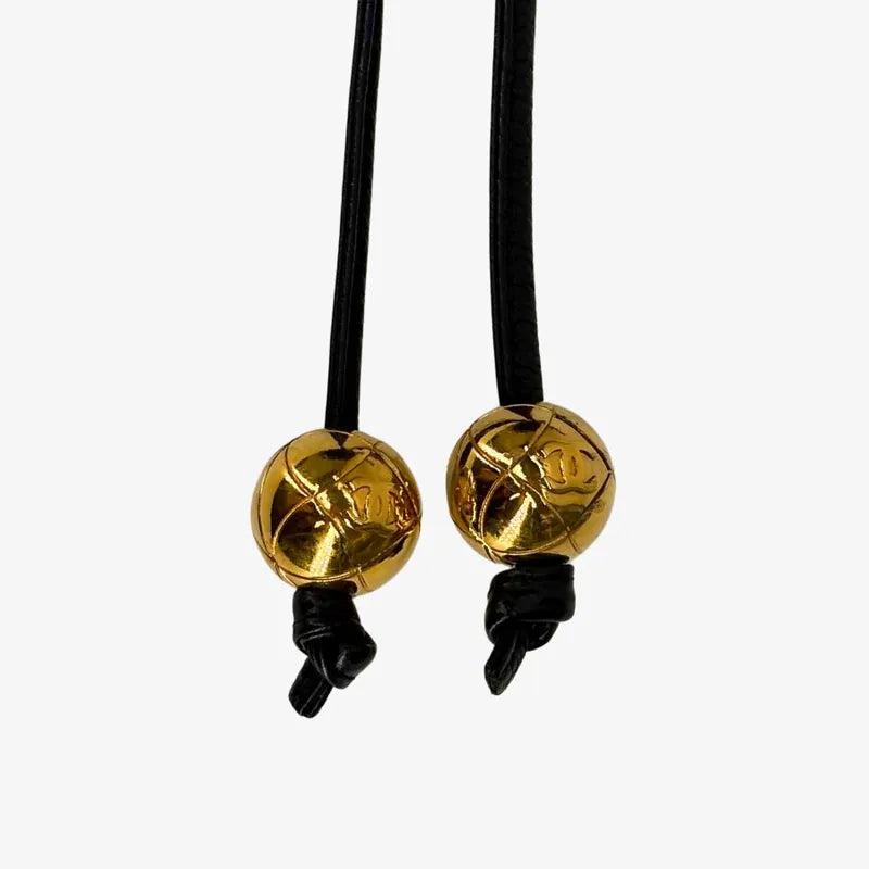 JW675 - CHANEL Vintage Black Caviar Leather Golden Ball Bucket Bag