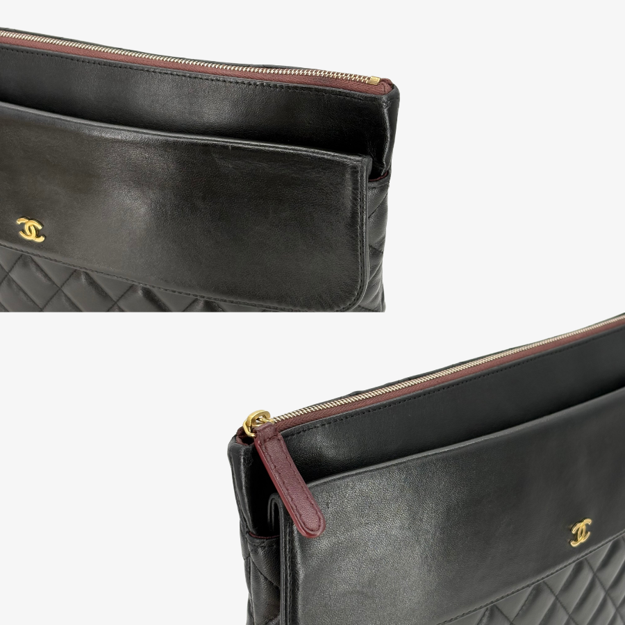RG370 - CHANEL Vintage Black Lambskin Zip And Flap Clutch Bag