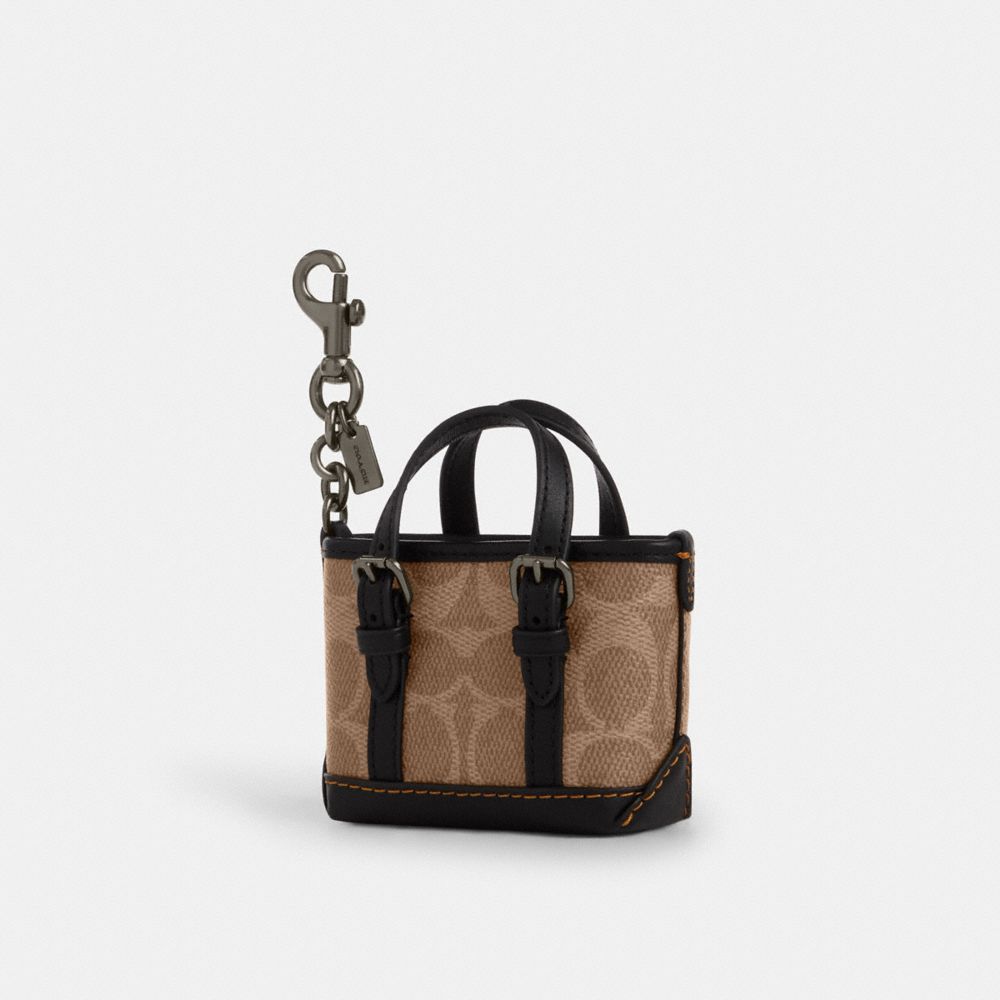Mini Warner Tote Bag Charm In Signature Canvas