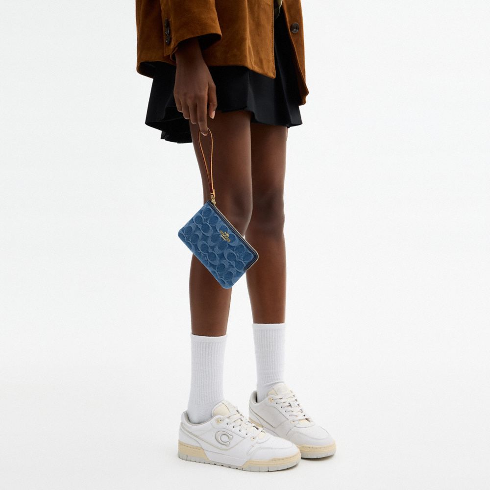 Coach Corner Zip Wristlet In Signature Denim Gold Indigo