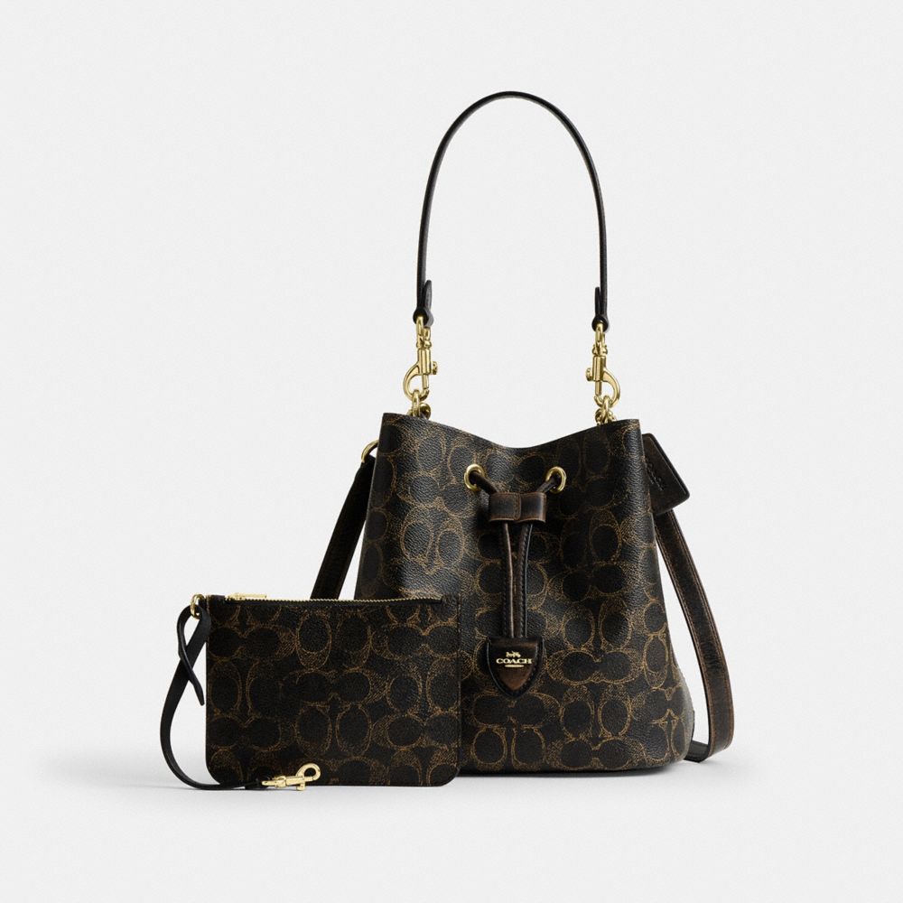 Rowan Bucket Bag In Loved Signature Canvas With Charms