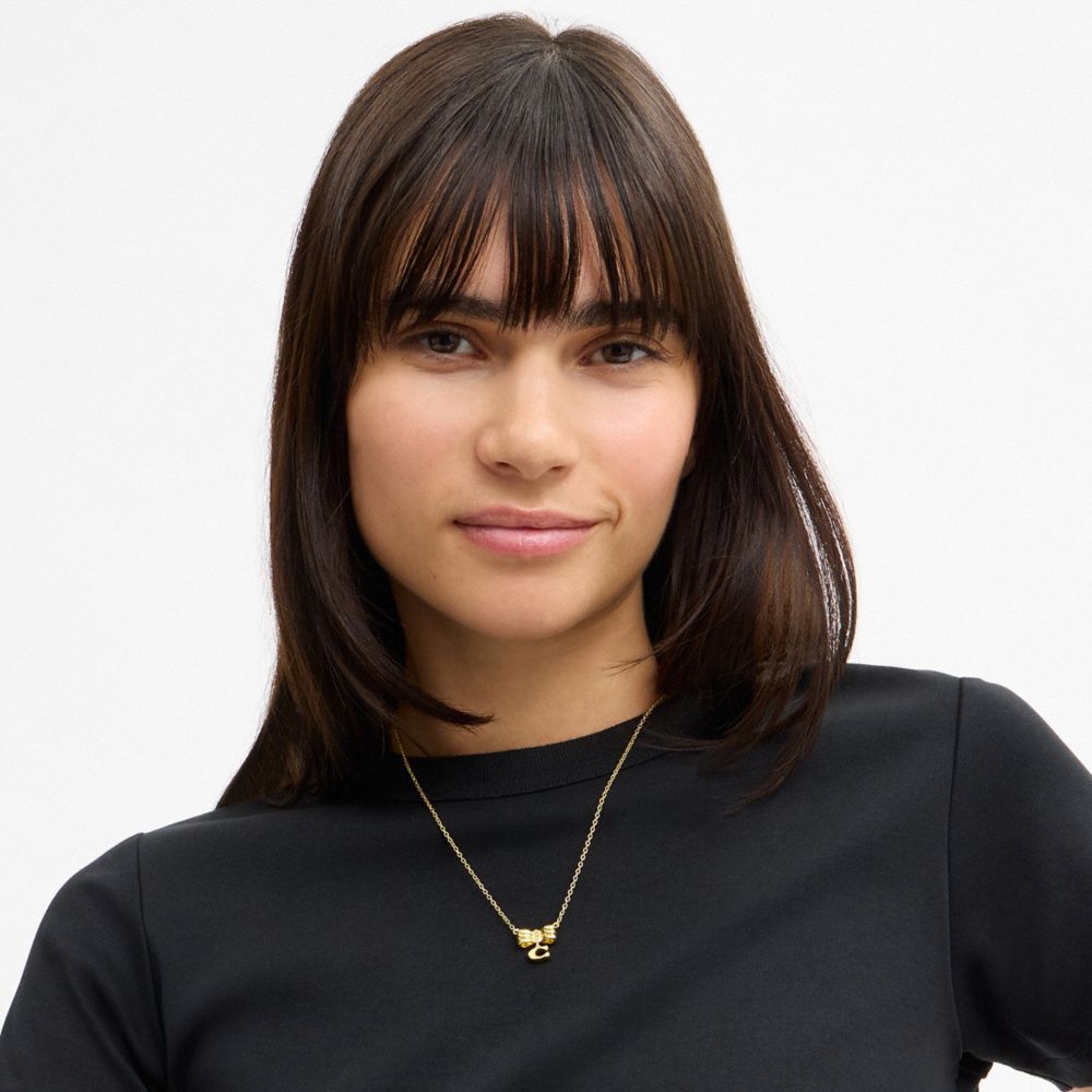 Coach Signature Bow Pendant Necklace Gold