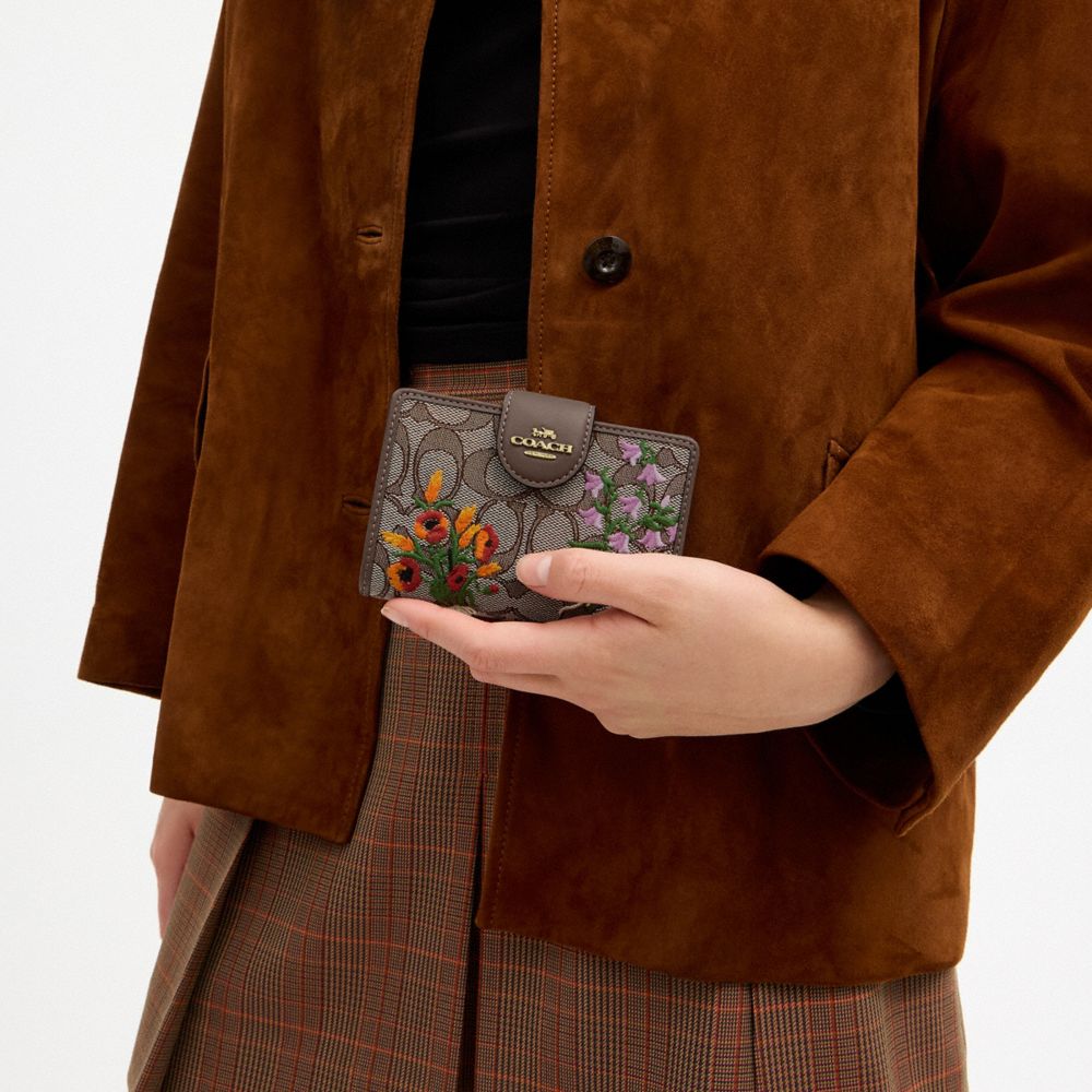 Coach Medium Corner Zip Wallet In Signature Jacquard With Floral Embroidery Gold Oak Multi
