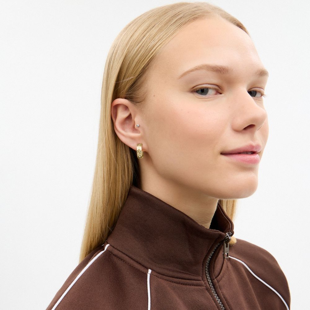 Coach Repeated C Huggie Earrings Gold