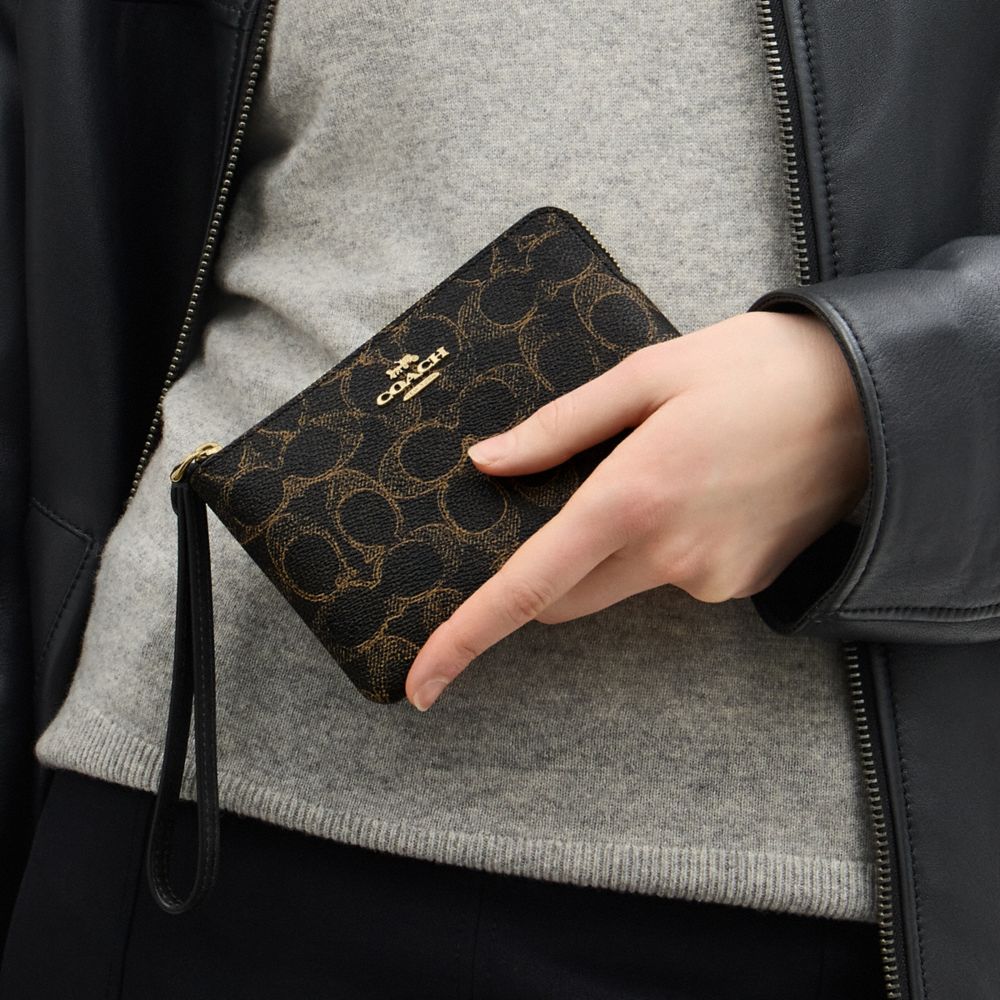 Coach Corner Zip Wristlet In Loved Signature Canvas Gold Brown