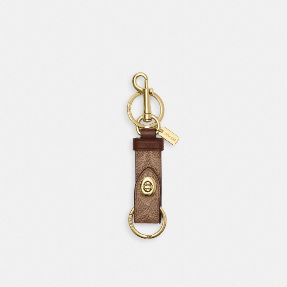Coach Trigger Snap Bag Charm In Signature Canvas Gold Tan Brown