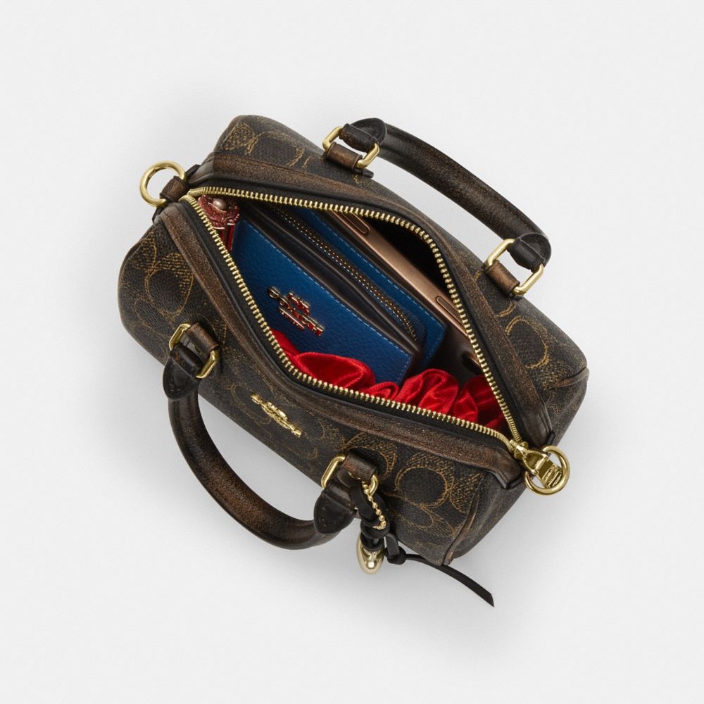 Mini Rowan Crossbody Bag In Loved Signature Canvas With Charms