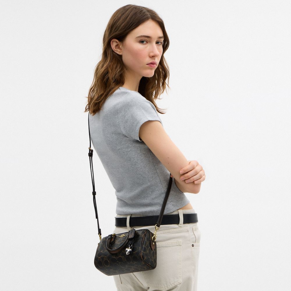 Mini Rowan Crossbody Bag In Loved Signature Canvas With Charms