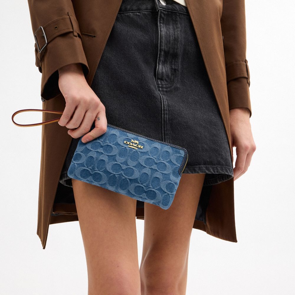 Coach Large Corner Zip Wristlet In Signature Denim Gold Indigo