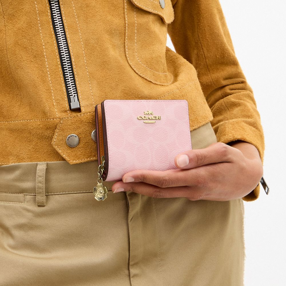 Coach Snap Wallet In Signature Canvas With Charm Gold Powder Pink