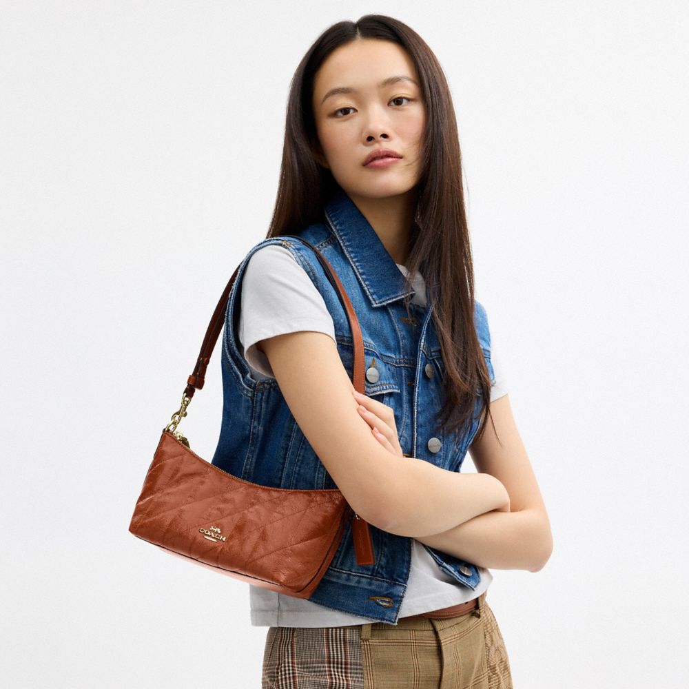Coach Caitlin Shoulder Bag With Quilting And Charm Gold Cinnamon