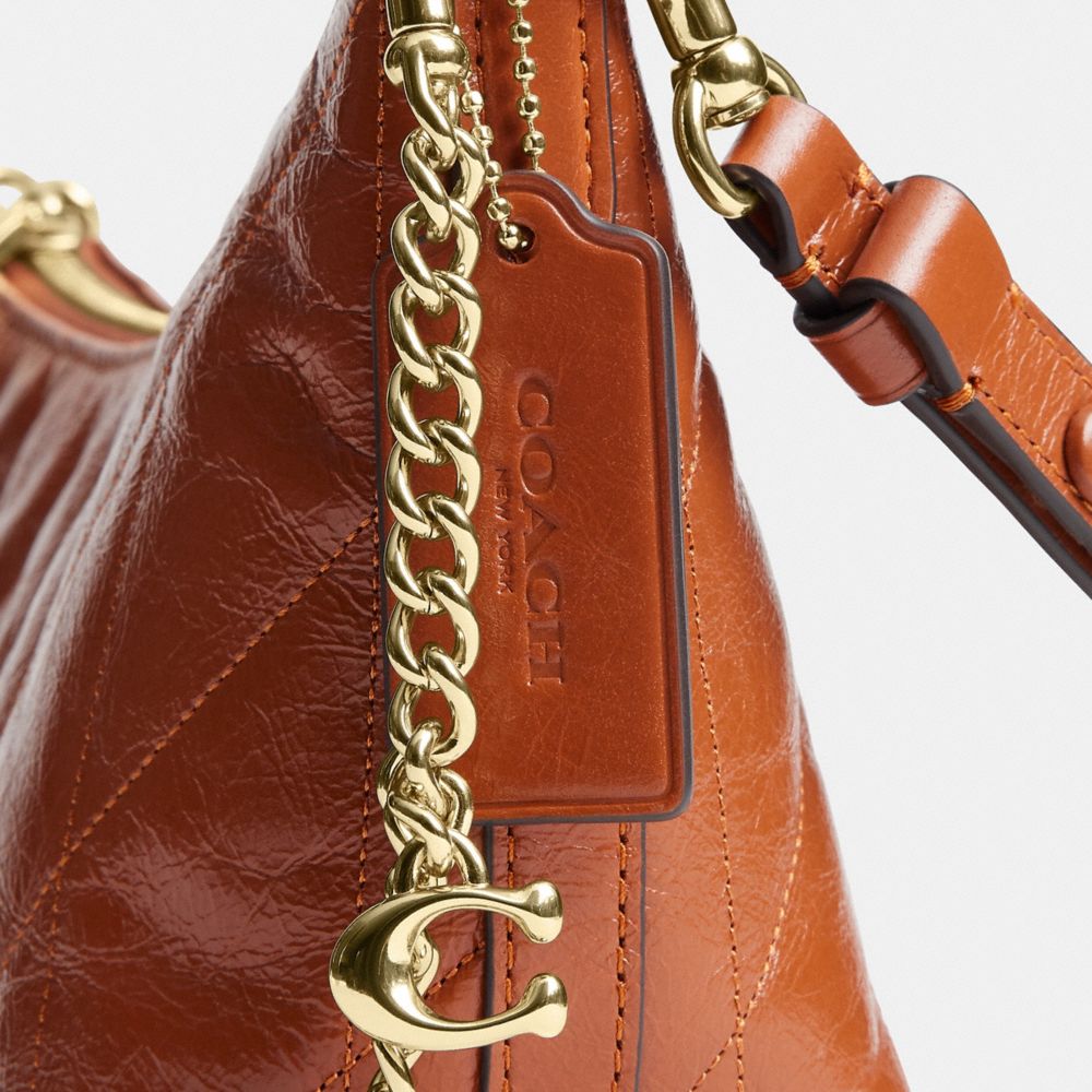 Coach Caitlin Shoulder Bag With Quilting And Charm Gold Cinnamon