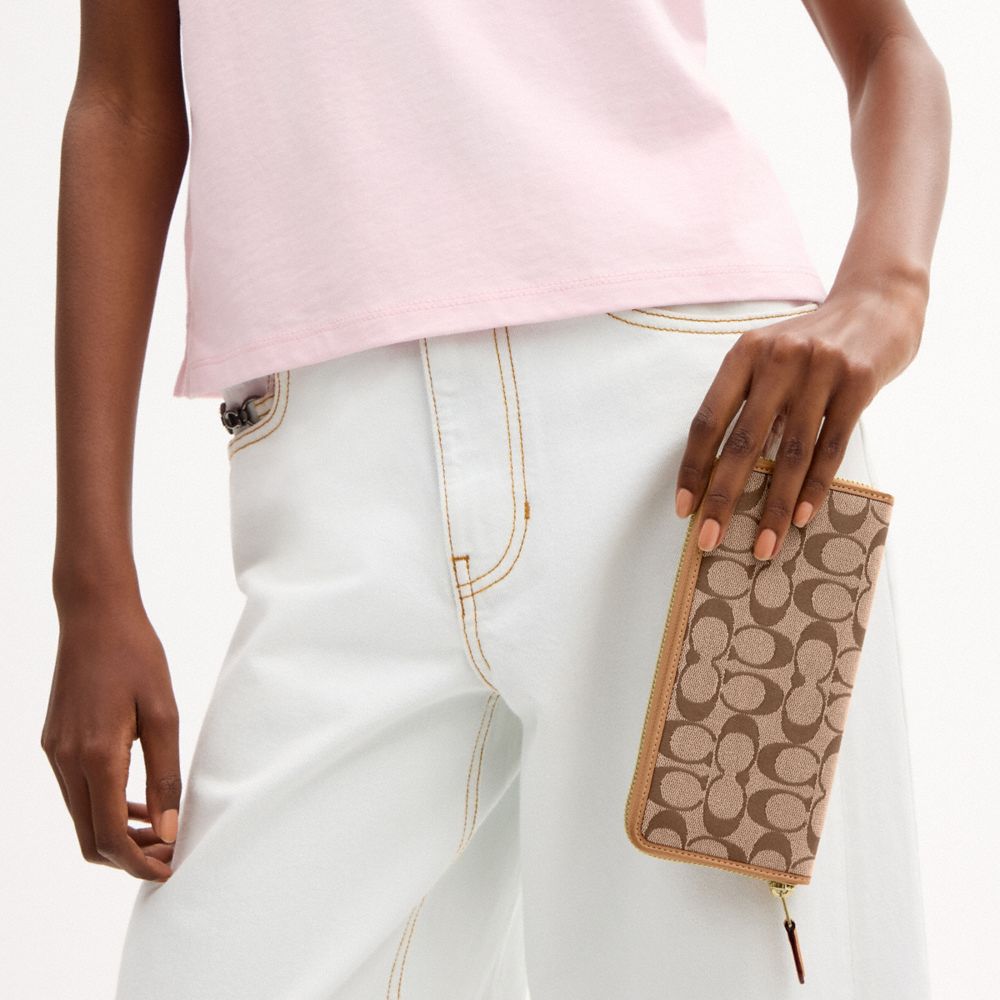 Coach Essential Slim Accordion Zip Wallet In Signature Jacquard Brass Khaki Light Peach