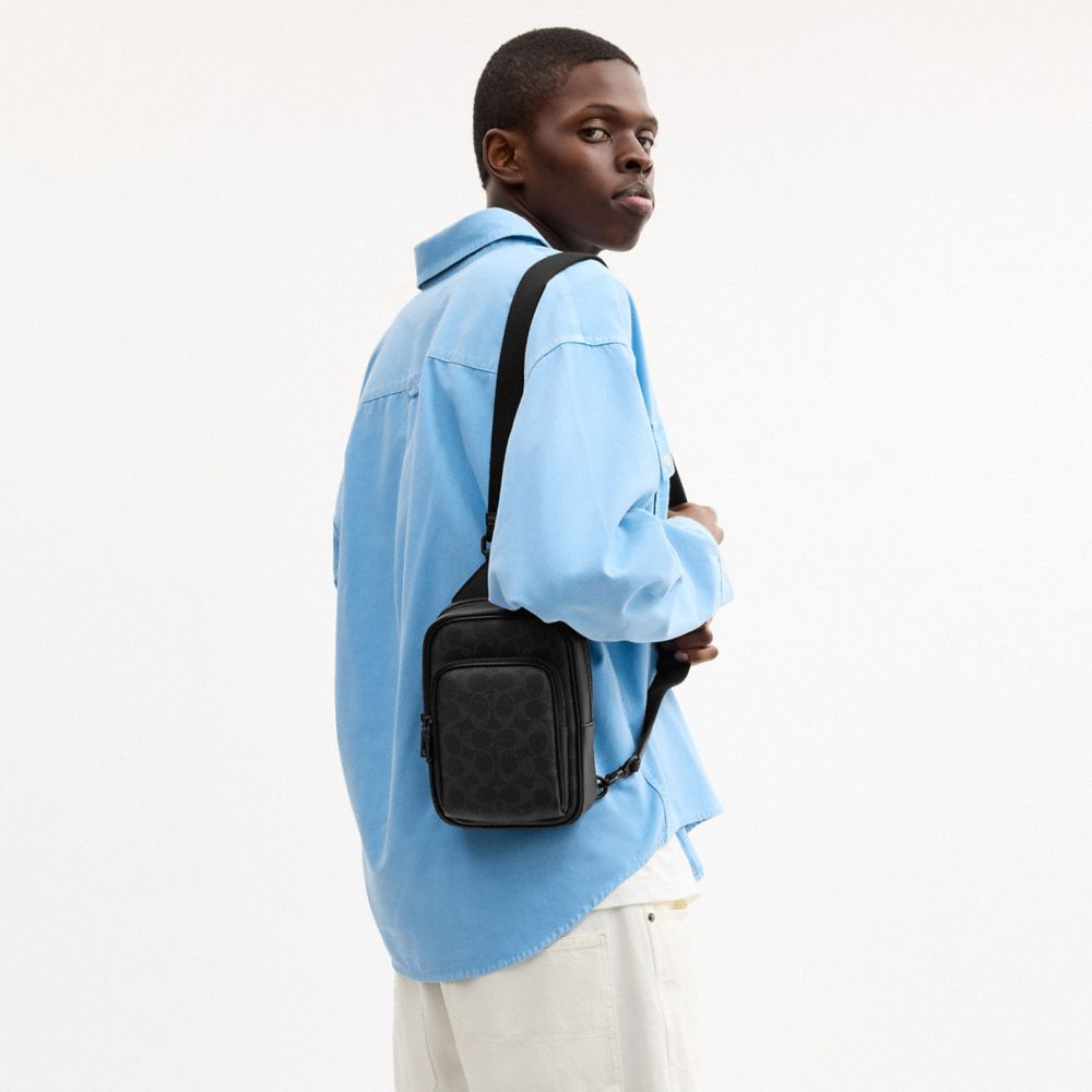 Coach Racer Sling Pack In Signature Canvas Matte Black Black Signature