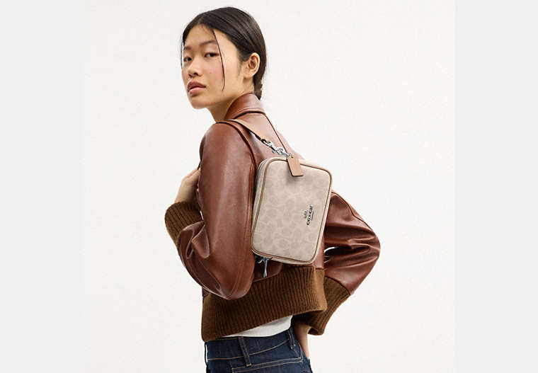 Mini Carey Crossbody Bag In Signature Canvas