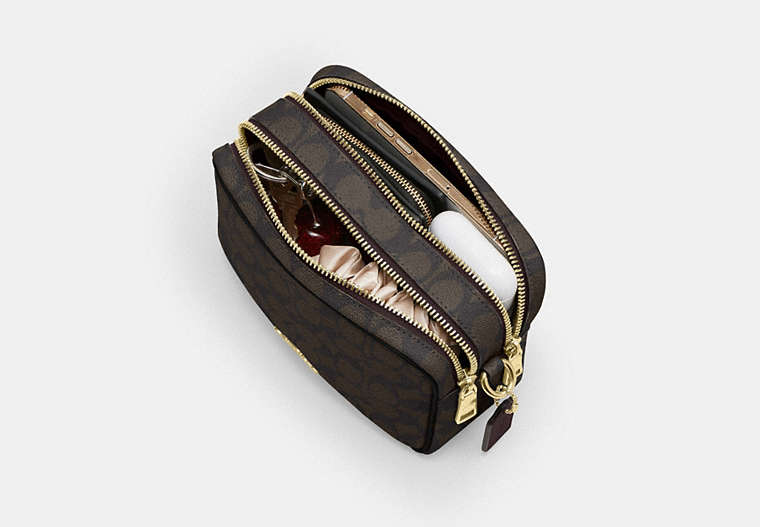 Mini Carey Crossbody Bag In Signature Canvas