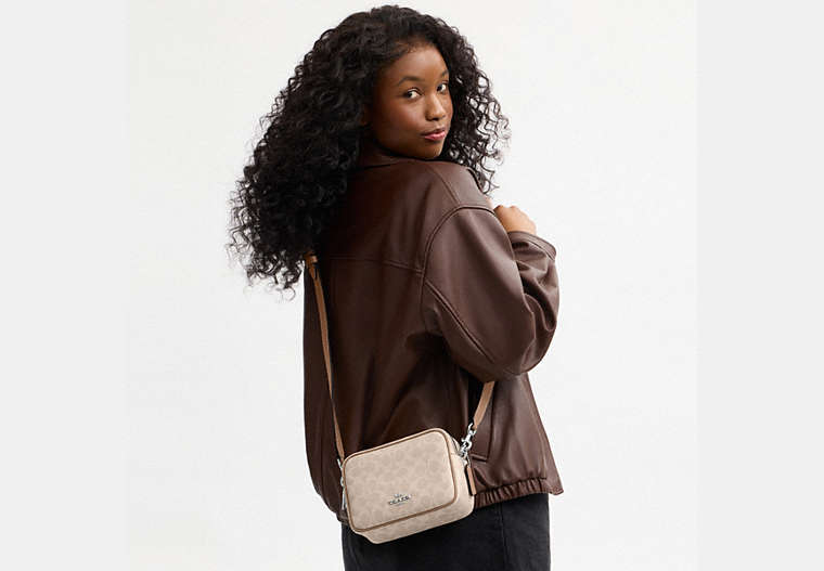 Mini Carey Crossbody Bag In Signature Canvas