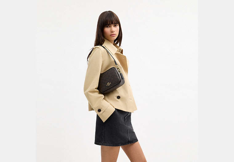 Mini Carey Crossbody Bag In Signature Canvas