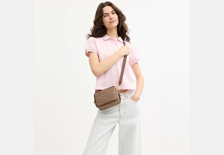 Mini Carey Crossbody Bag In Signature Canvas