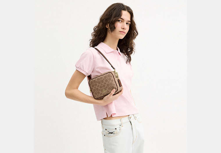 Mini Carey Crossbody Bag In Signature Canvas
