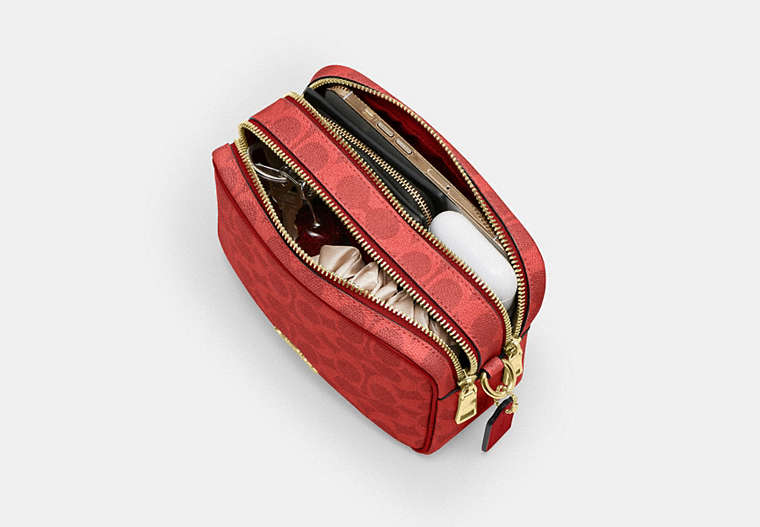 Mini Carey Crossbody Bag In Signature Canvas