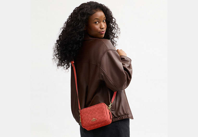 Mini Carey Crossbody Bag In Signature Canvas