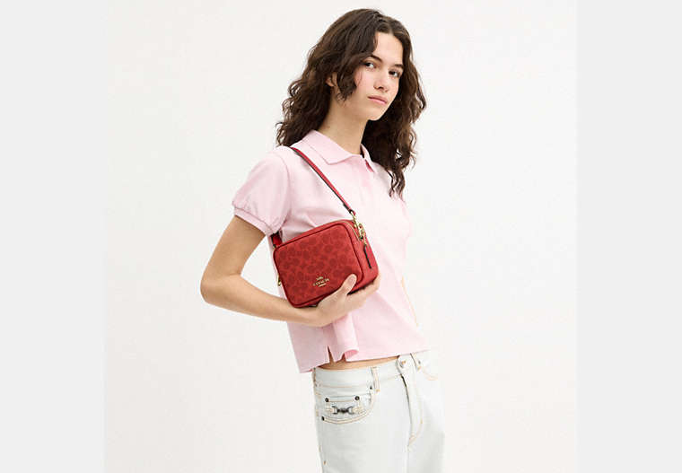 Mini Carey Crossbody Bag In Signature Canvas