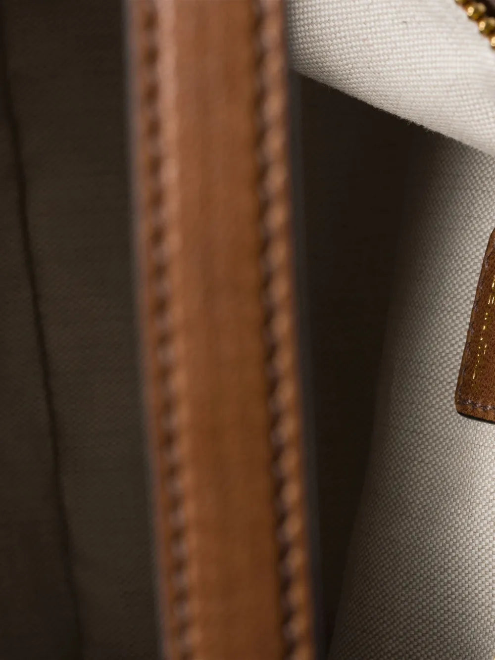 logo-embossed shoulder bag