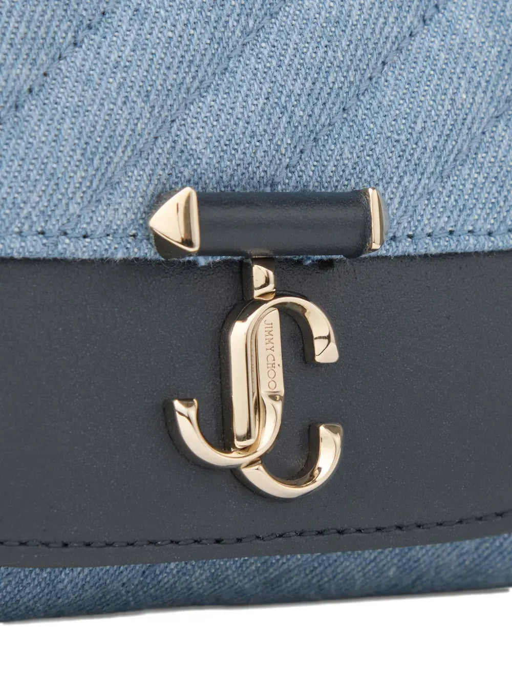 Curve quilted clutch bag