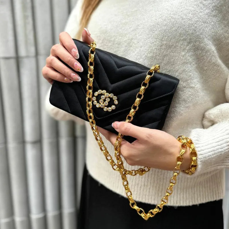 JT719 - CHANEL Vintage Black Satin Chevron Gold Chain Flap Bag