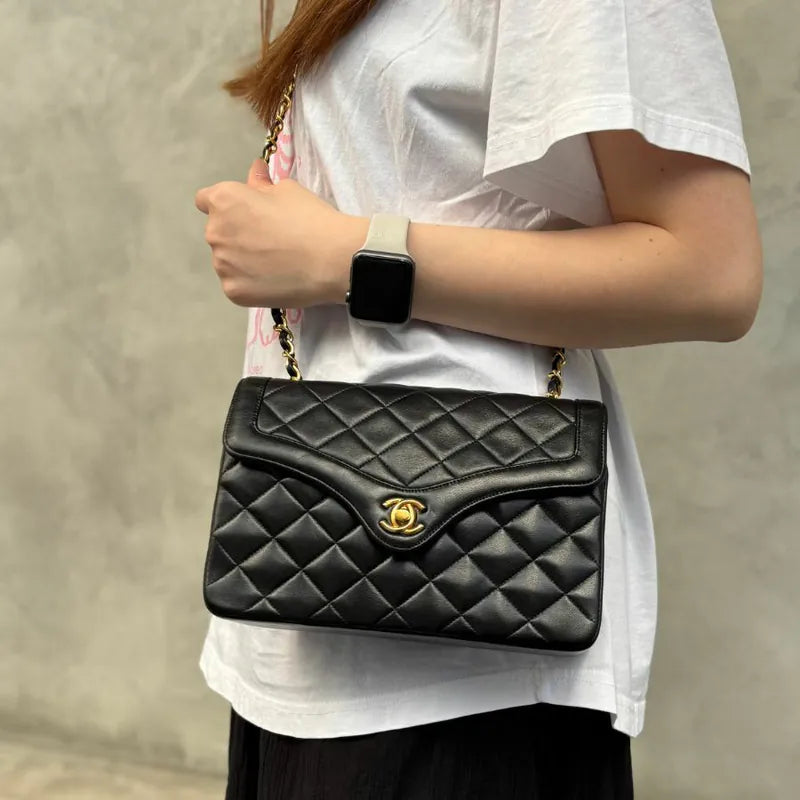 RA652 - CHANEL Vintage Black Lambskin Quilted Flap Bag